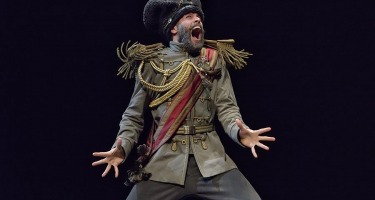 Dancer in military dress costume yelling.