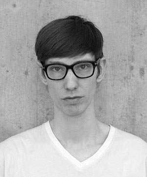 Black and white portrait of Alan Lucien.