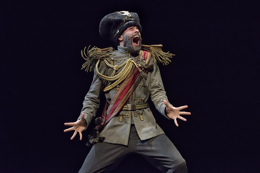 Character in full military dress yelling.